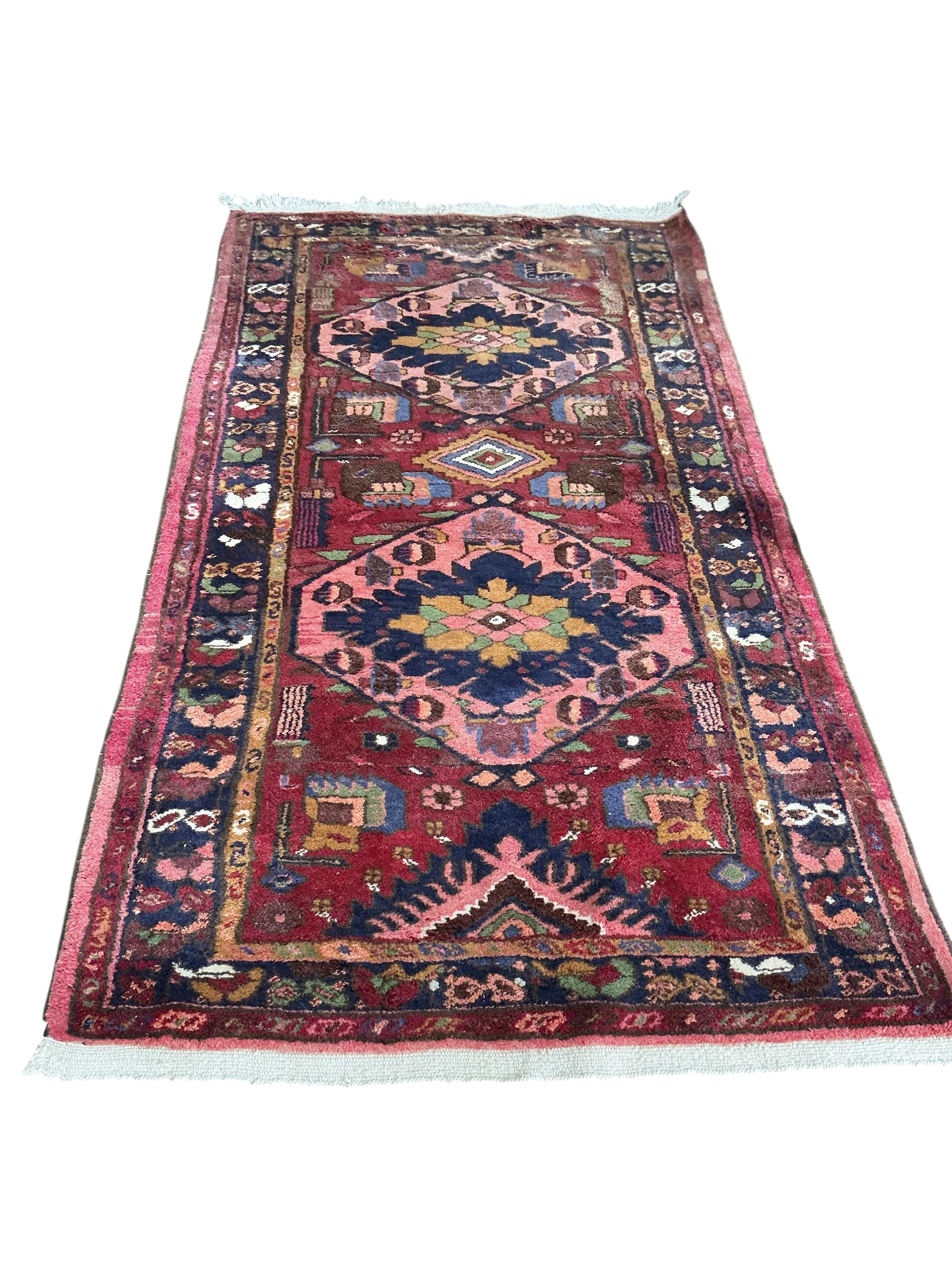 A Karabagh red ground rug, 200 x 112cm